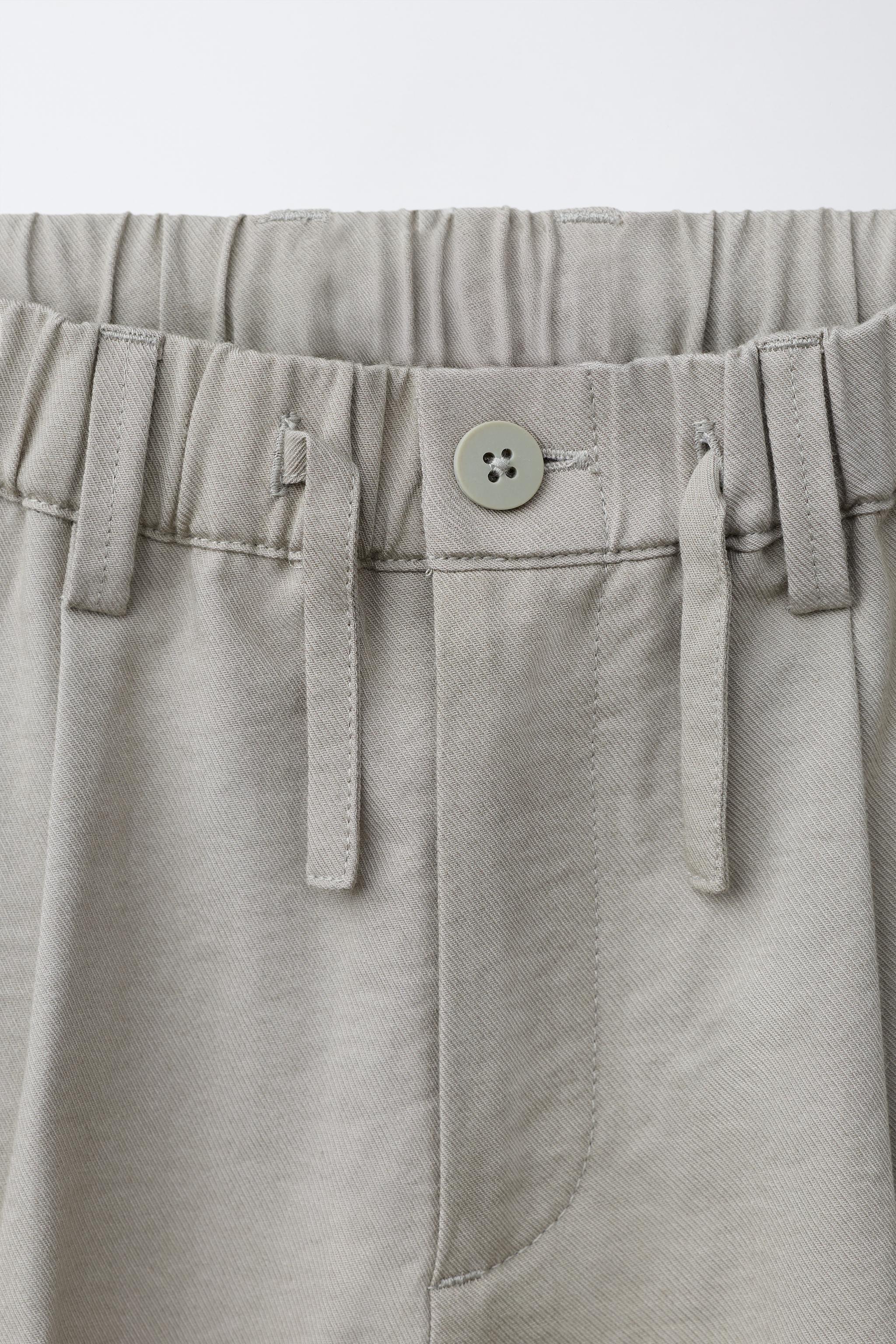 FLOWY PLEATED PANTS